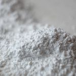 Scatter calcium carbonate powder. Close up photo.